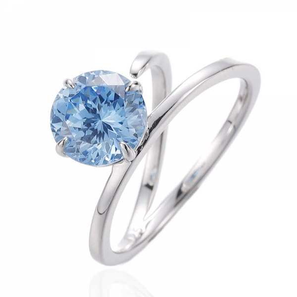 Anillo de plata rodiada con circonita cúbica azul y diamante redondo 