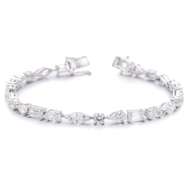 Pulsera de plata rodiada con circonita cúbica de color G y diamante de talla esmeralda y forma ovalada 