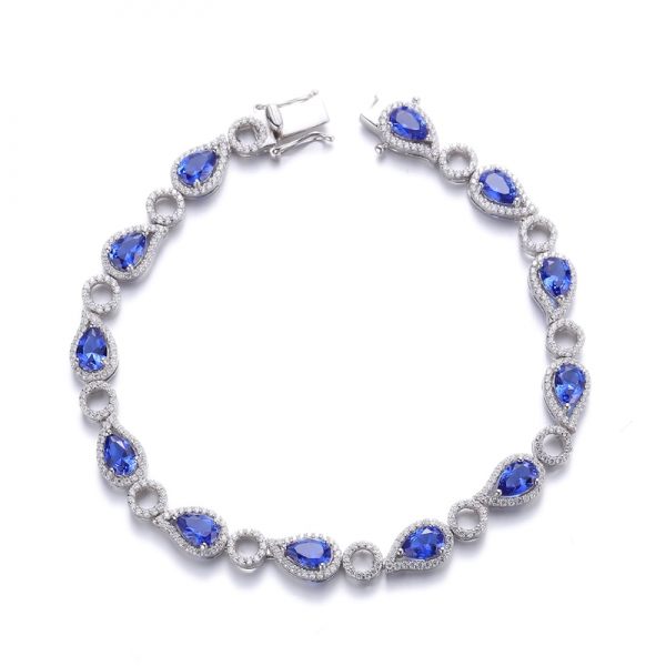 Pulsera de plata rodiada con circonita cúbica blanca redonda y nano azul en forma de pera 