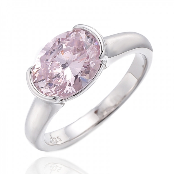 Anillo de plata rodiada con circonita cúbica rosa y diamante de forma ovalada
     