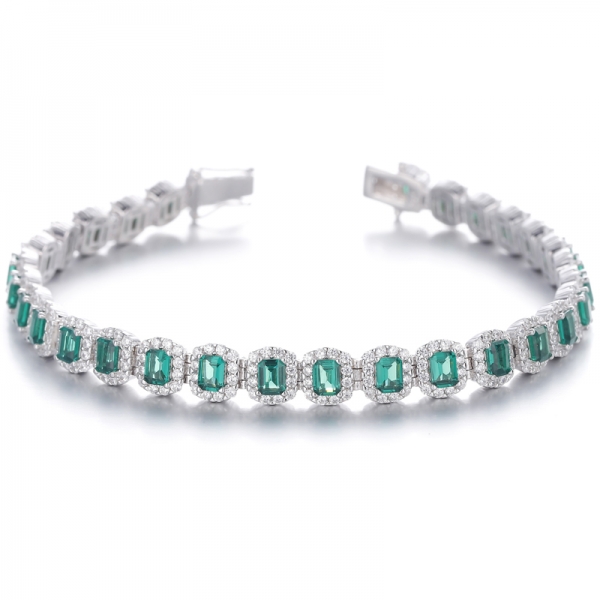 
     Pulsera de plata rodiada con circonita cúbica blanca redonda y nano verde de corte esmeralda
     